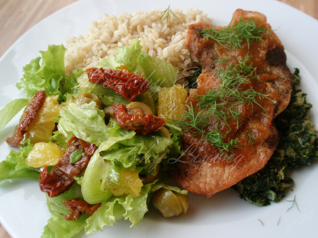 Turkey breast on spinach with orange salad