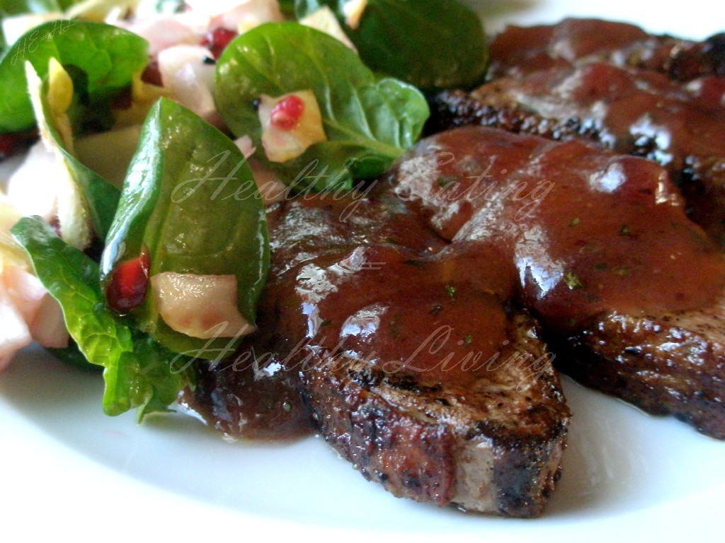 Grilled duck with spinach and pomegranate salad