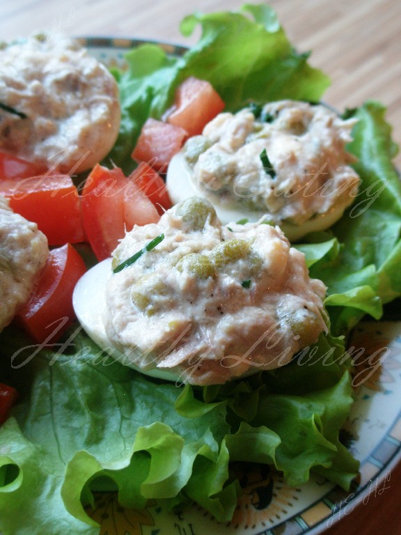 Eggs stuffed with olives and green peas