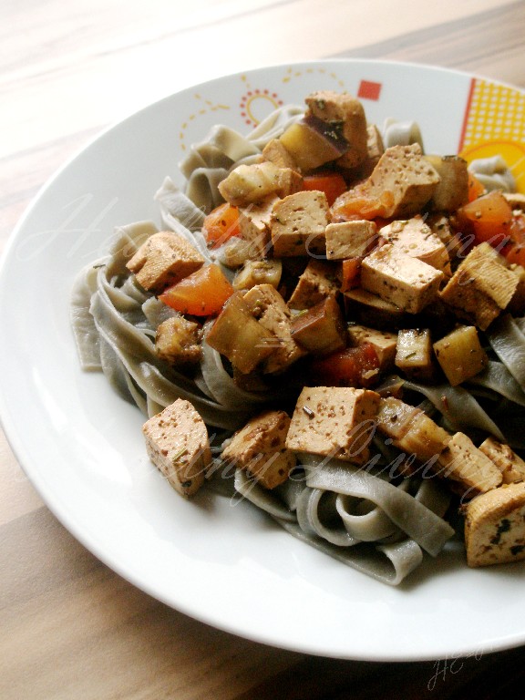 Marinated tofu with black tagiatelle