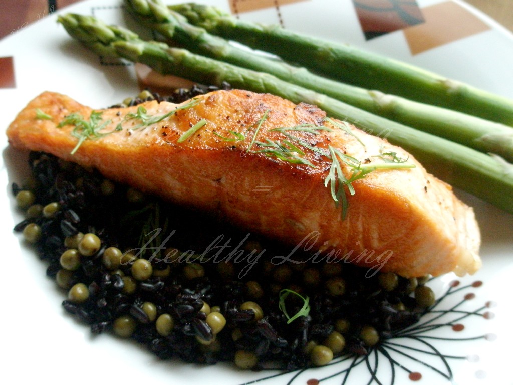 Grilled salmon served on black rice 