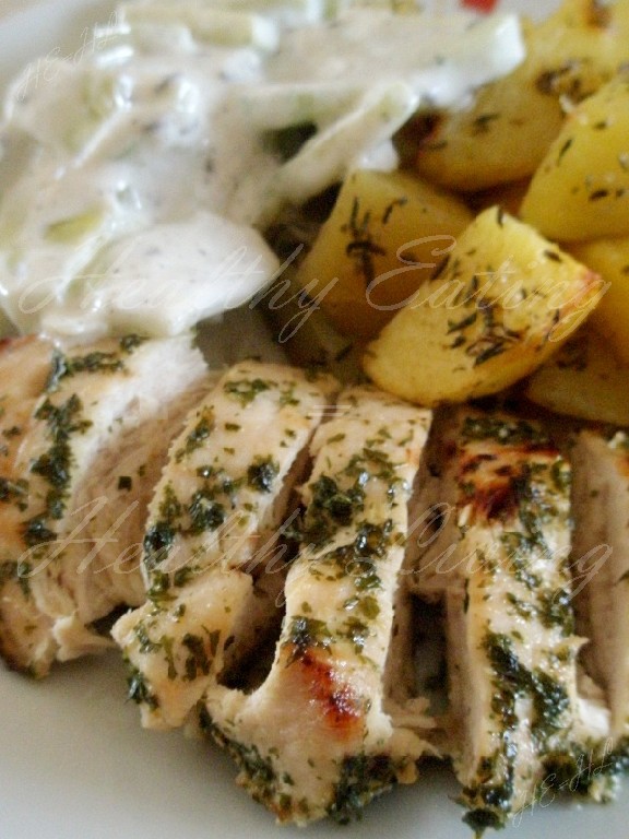 Chicken in honey, baked potatoes and cucumber salad