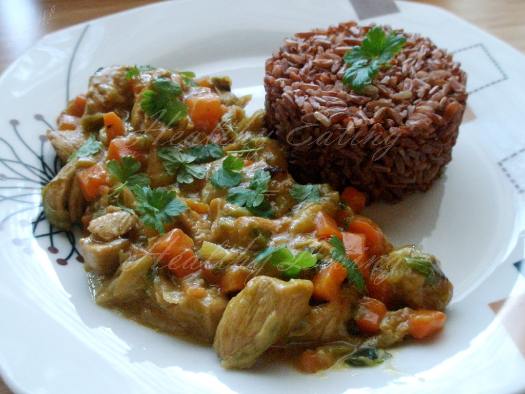 Chicken in coconut milk on red rice