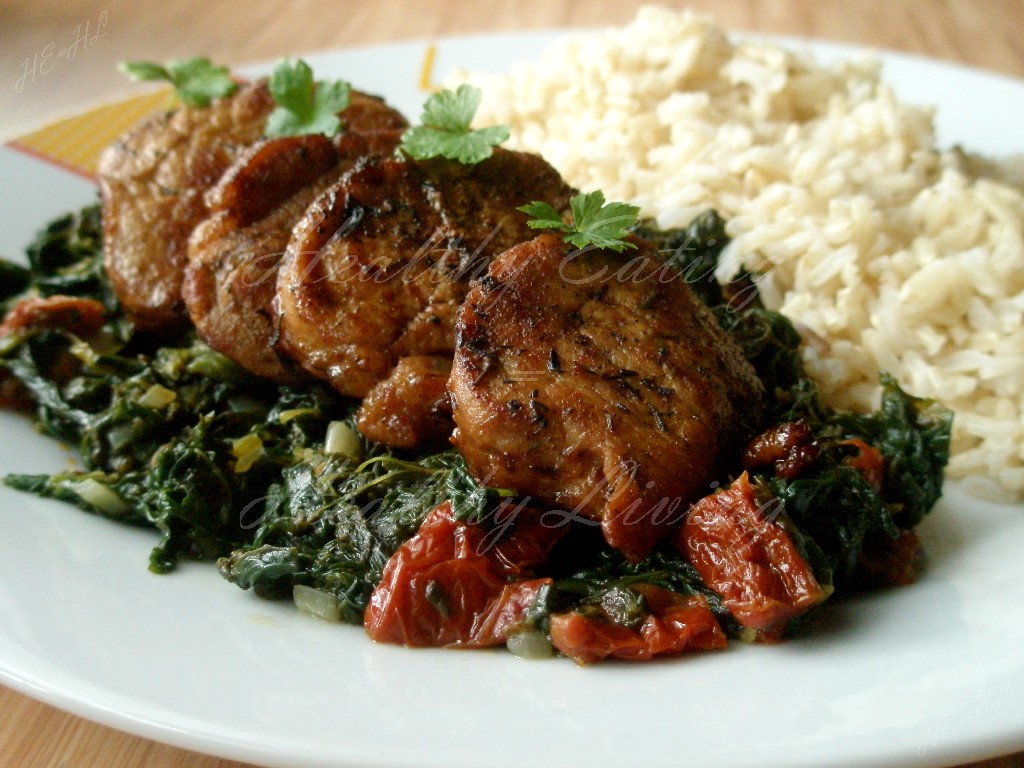 Stewed tenderloin on tomato spinach