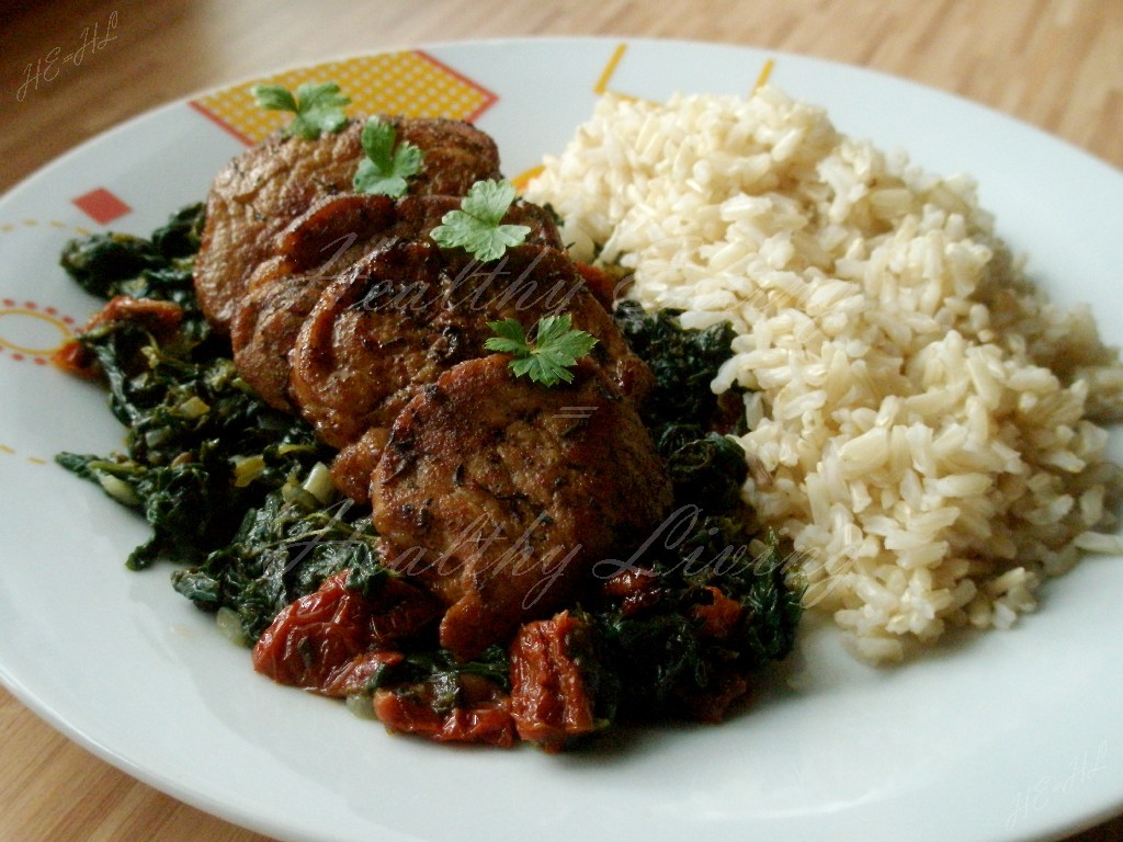 Stewed tenderloin on tomato spinach