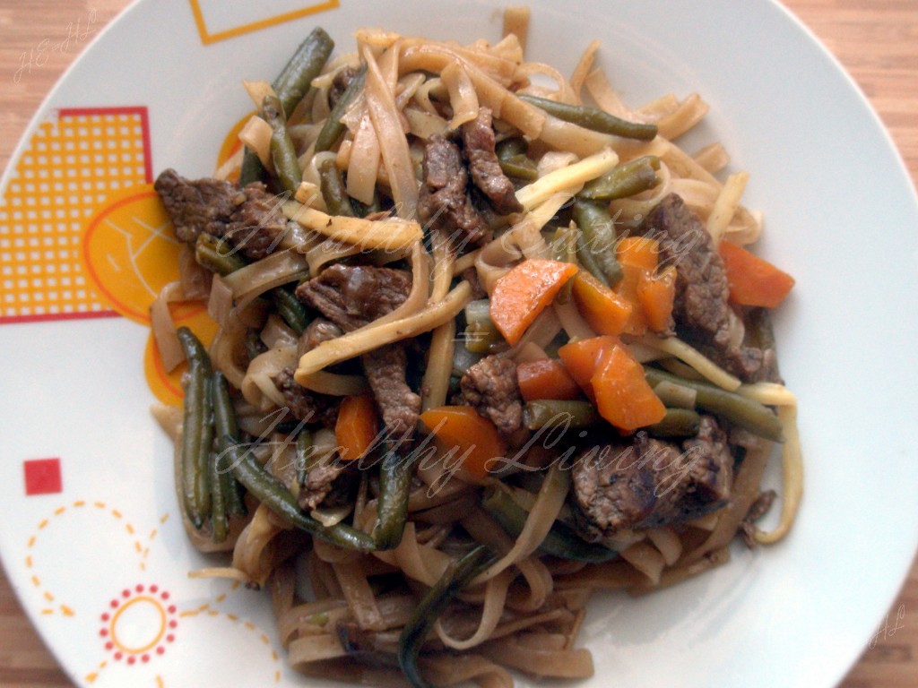 Stewed beef with vegetables and rice pasta