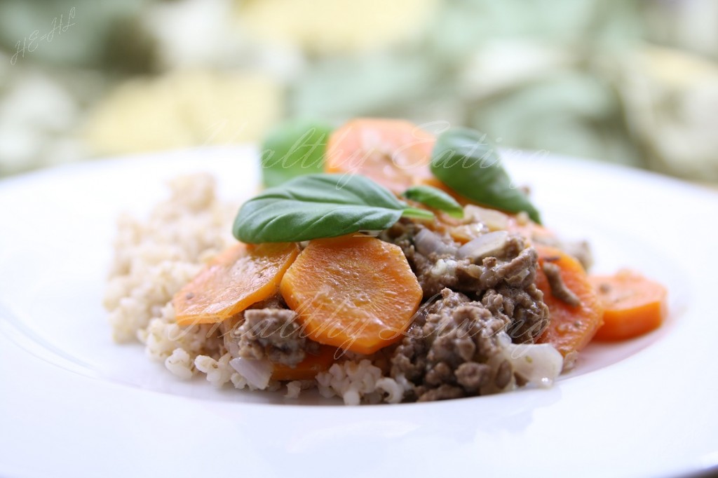 Stewed beef served with carrot and barley groats