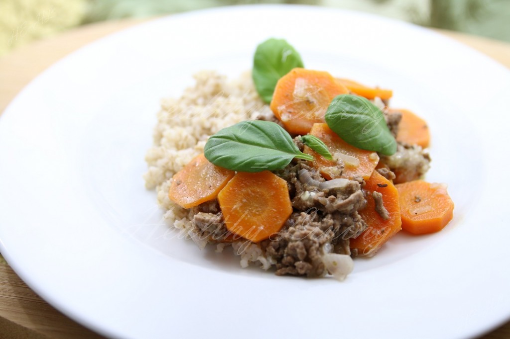 Stewed beef served with carrot and barley groats