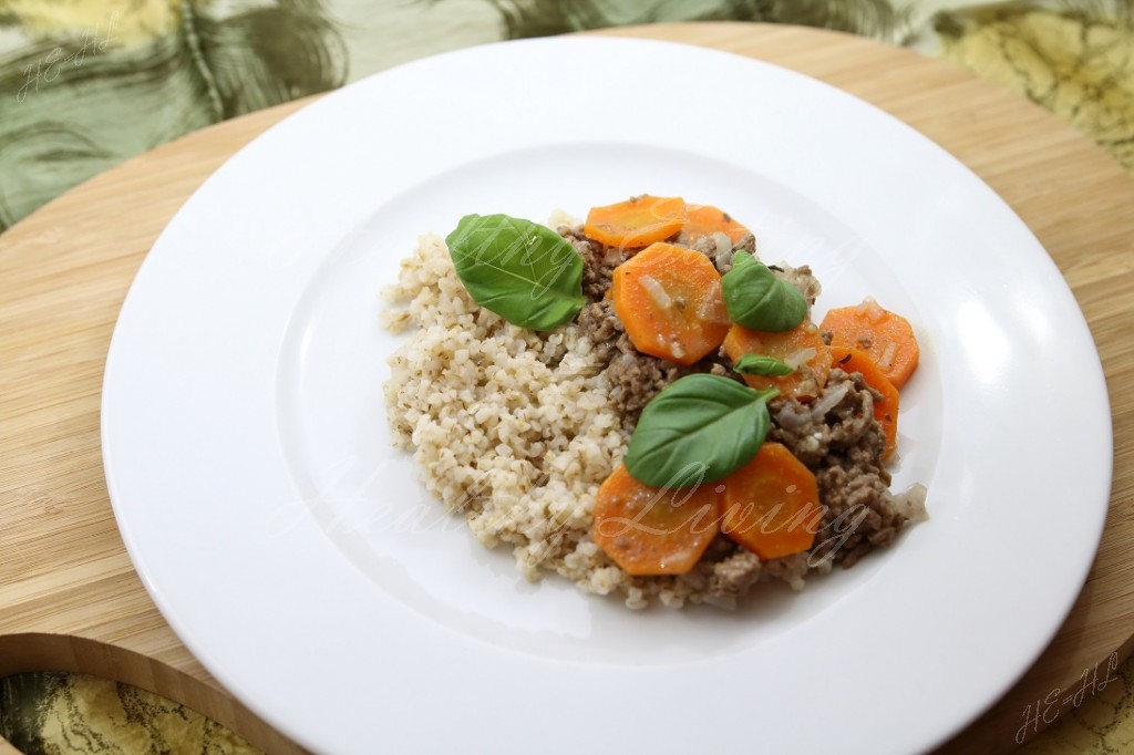 Stewed beef served with carrot and barley groats